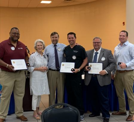 Dr. Woods shown with 5 other Paul Harris Fellows. 